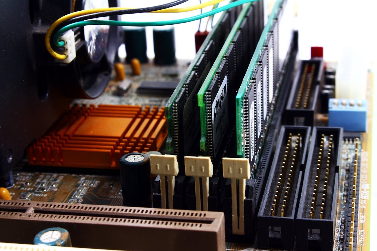 about-02 Detailed view of computer motherboard featuring RAM, chipset, and wiring.